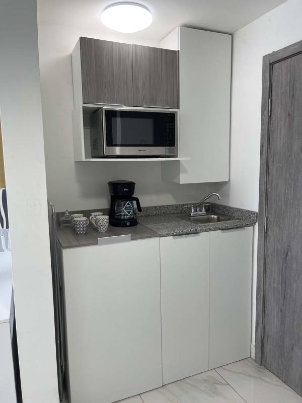Modern minimalist bathroom with marble tile walk-in shower at PH Marina Vista