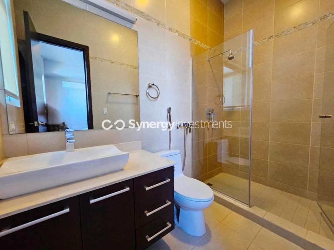 Modern luxury bedroom with floor-to-ceiling windows, skyline views and ensuite bath in PH Celeste Costa del Este Panama