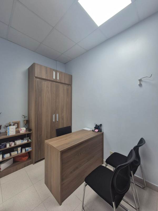 Private office desk and cabinetry with tile floors inside Pacific Salud Hospital Tower Panama City