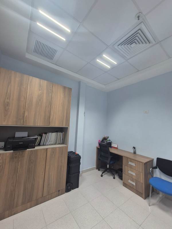 Compact medical office with built-in storage and ceramic tiling at Pacific Salud Tower