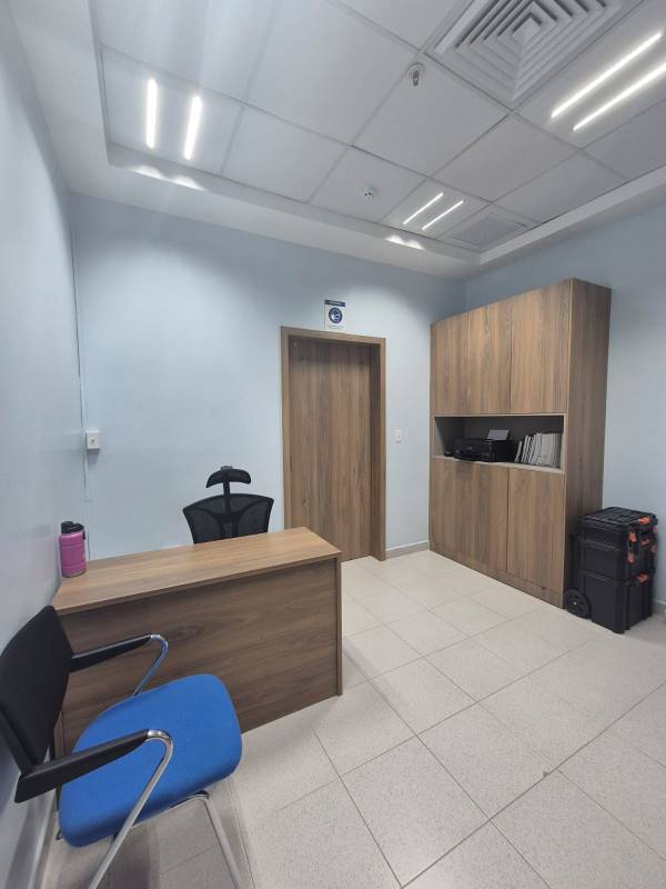 Private workspace with tile floor furniture in Pacific Salud Hospital Tower Panama City