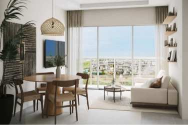 Minimalist open-plan living dining area with balcony overlooking gardens Playa Caracol Panama