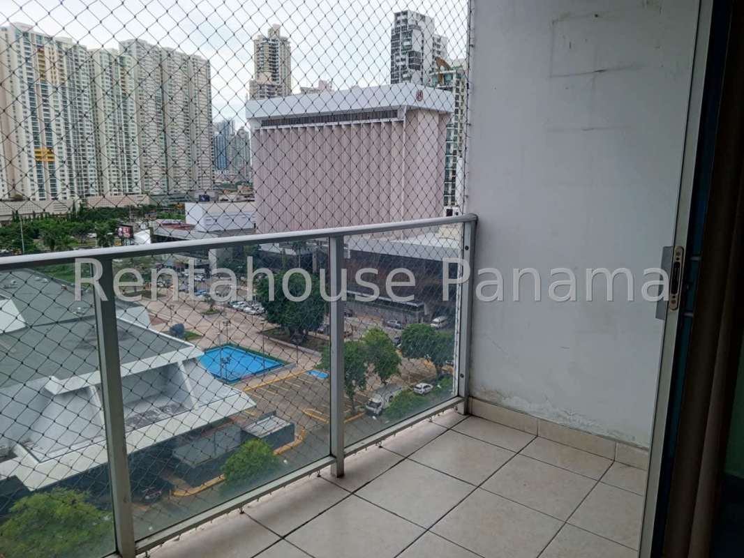 Balcony overlooking pool area and city skyline in PH Serenity at the Bay