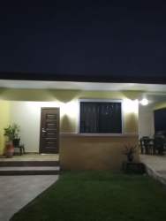 Spacious kitchen with granite countertops and stainless steel appliances in rural Dolega, Panama.