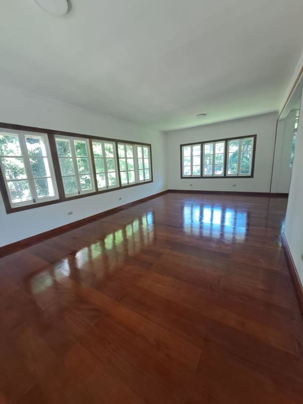 Bathroom with beige tiles, pedestal sink, window for light in Clayton Albrook Panama duplex