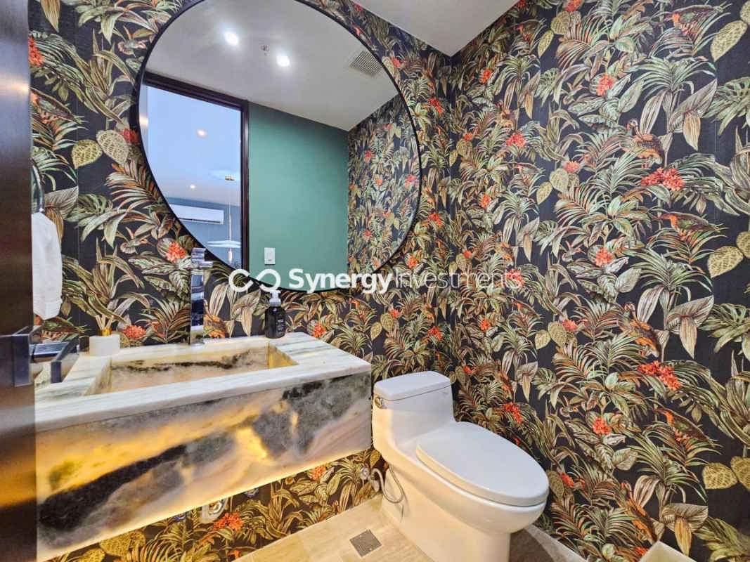 Balcony with glass railing, grill, city and ocean view at PH Costa del Este Prime Panama