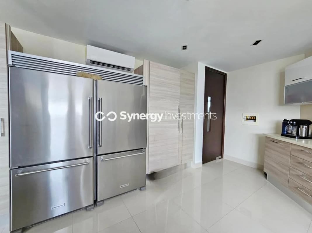 Modern clubhouse building with swimming pool, mural and gardens Costa del Este Prime