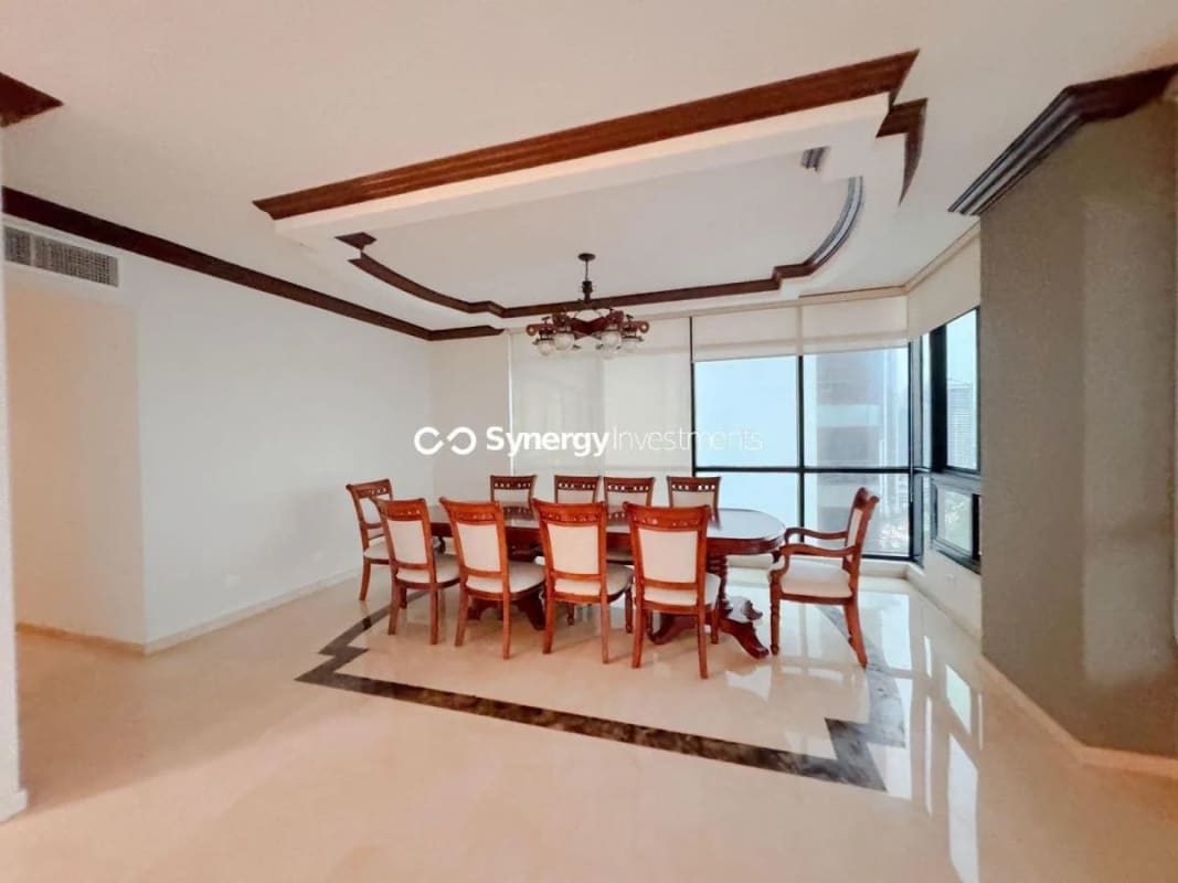 Elegant formal dining room with panoramic city skyline view marble floors PH Miramar Panama