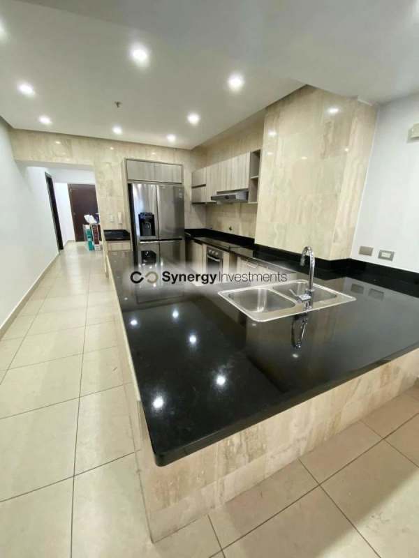 Modern bathroom with walk-in glass enclosed shower and double sinks at PH BICSA Avenida Balboa Panama City