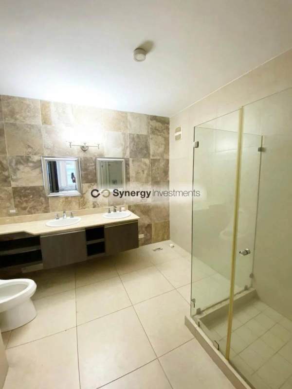 Remodeled open kitchen with marble island peninsula and appliances at PH BICSA Avenida Balboa Panama