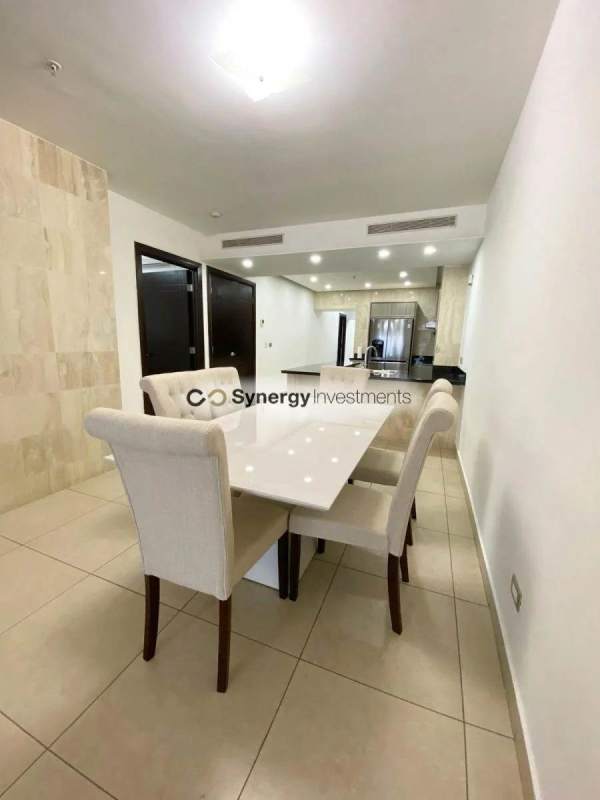 Open dining area with living room ocean views in PH BICSA Avenida Balboa Panama City