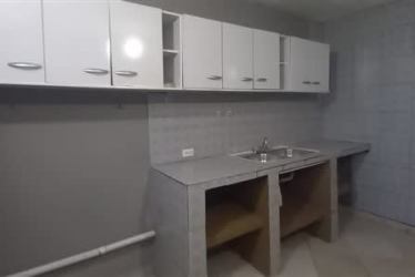 Simple kitchen area white cabinets concrete counter sink townhouse Arraiján Panama