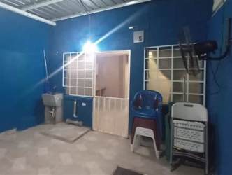 Covered patio utility area utility sink plastic chairs blue walls townhouse Vista Alegre Panama