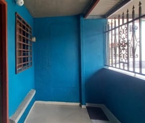 Entry porch with blue walls metal bars affordable townhouse Vista Alegre Panama