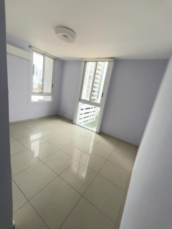 Bright living area with large windows and balcony access in PH Quadrat Panama