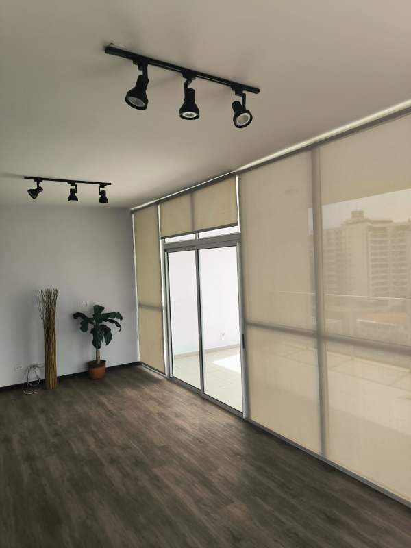 Stylish kitchen with granite countertops and stainless appliances in PH Quadrat Panama City