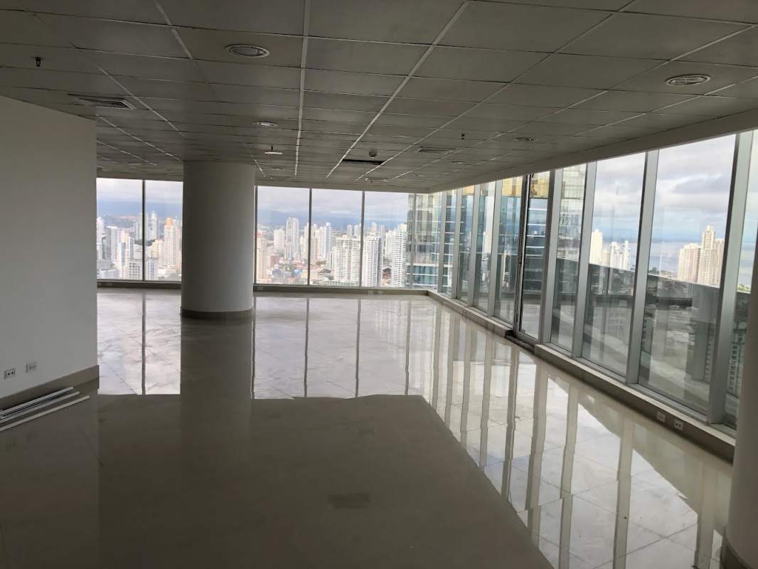 Luxury lobby of Revolution Tower with marble floors security turnstiles chandelier Panama City