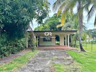 Covered terrace front patio with garden at Coronado beach house for sale Panama