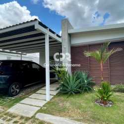 Open kitchen with granite, pendant lights, blue sofa background house Panama
