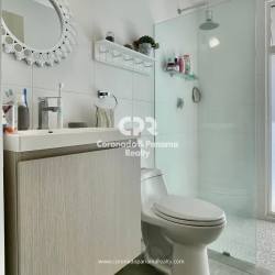 Bedroom with large window, AC, desk, twin beds in Punta Barco Panama