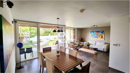 Contemporary living and dining room with ceramic floors and large windows PH Las Islas Villa Iguana Panama