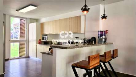 Covered terrace overlooking a private garden in PH Las Islas Villa Iguana Punta Barco Panama