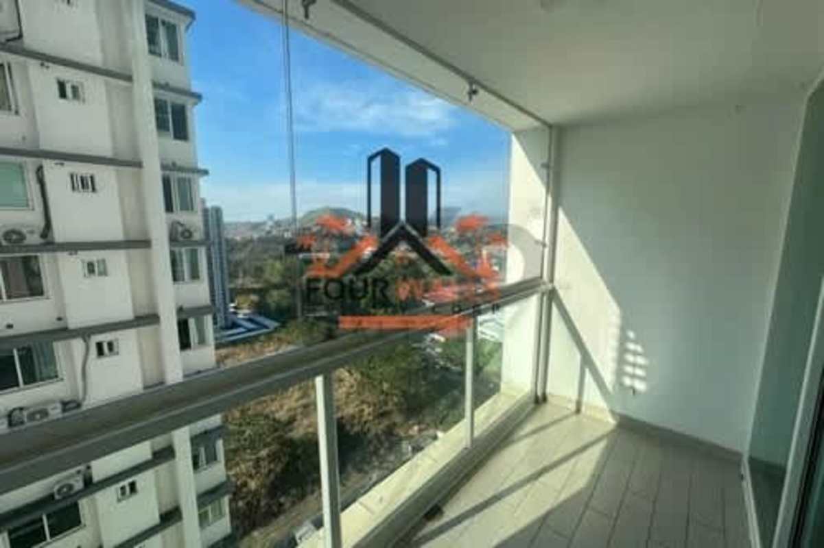 Dining area with glass doors leading to terrace in PH Kings Park Condado del Rey Panama