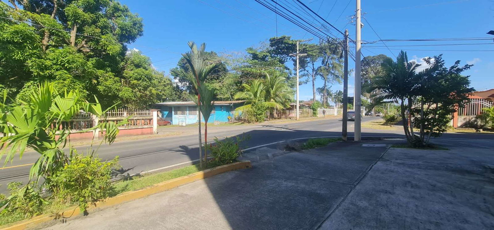 Parking area and multiple commercial garage doors at Ciudad Radial Commercial Plaza Panama City