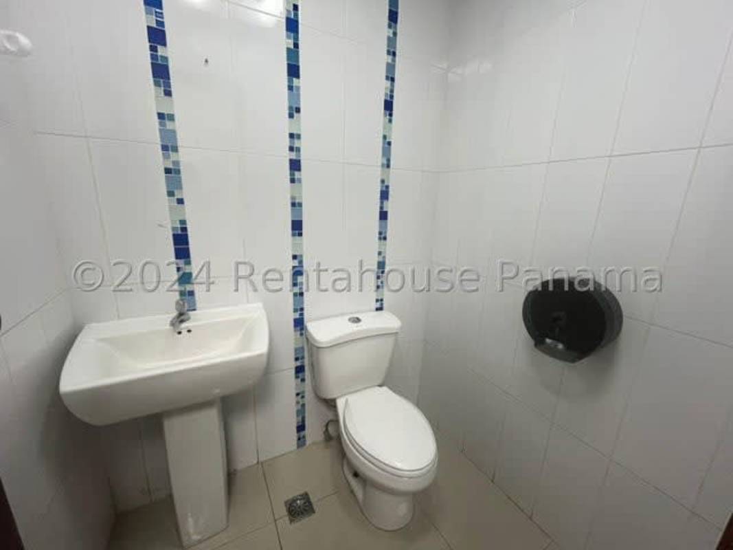 Glass enclosed office space with bright interior Torre Global Panama city