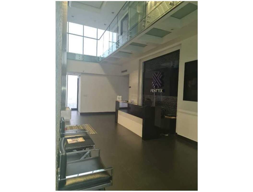 Elegant lobby reception area with double height ceiling, glass railings at PH SFC Tower Panama City