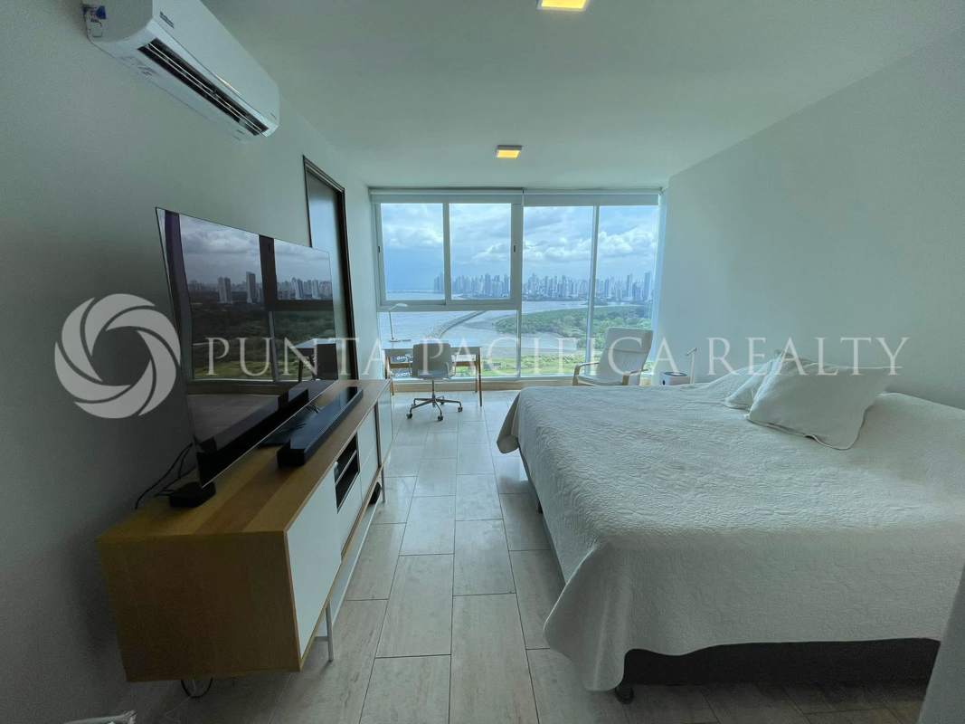 Bedroom home office with large window and panoramic city ocean view in PH Regent Costa del Este