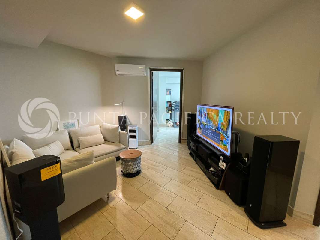 Elegant dining area adjoining open living room with marble tile floors in apartment PH Regent Panama