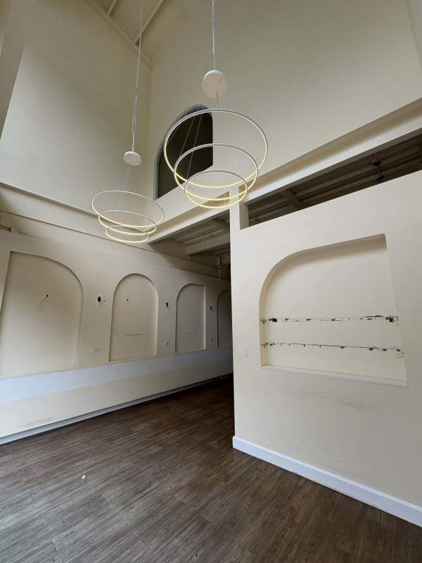 Modern commercial loft style space with arched niches and pendant lights Plaza SF69 Panama City.