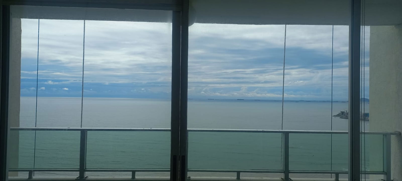 Bright living room featuring large windows and balcony access PH Terrawind San Francisco Panama