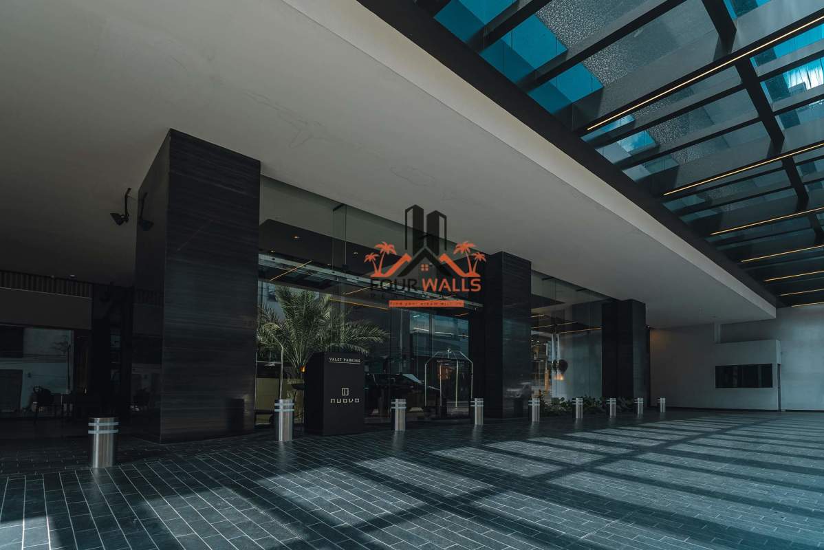 Unfinished commercial interior with floor-to-ceiling windows overlooking Panama City skyline in Nuovo Plaza