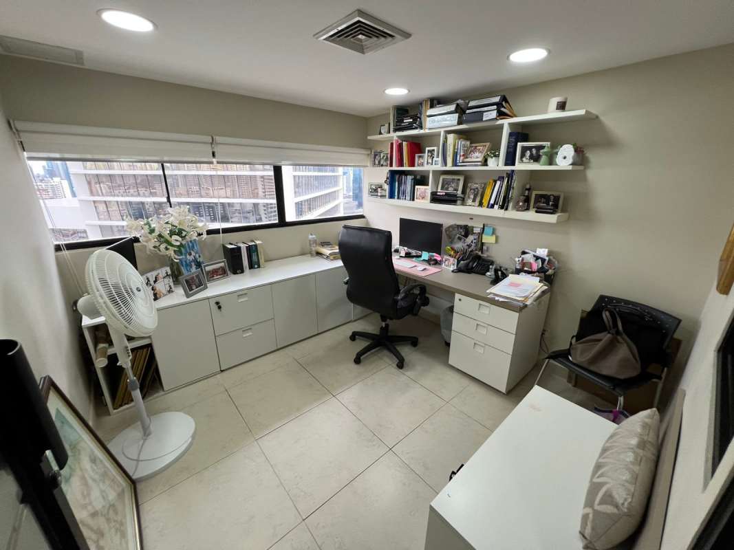 Spacious meeting room with glass partitions and conference table in Panama City office for sale