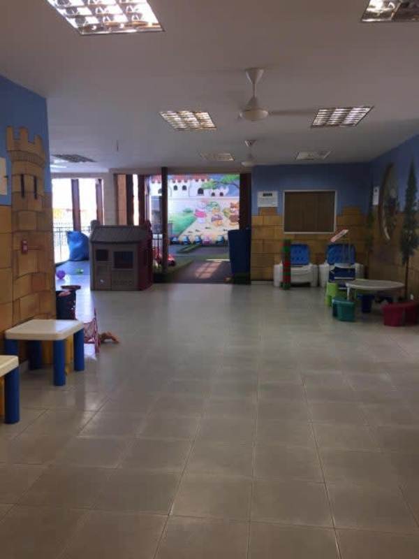 Colorful preschool classroom with murals, children-sized tables in San Francisco Panama