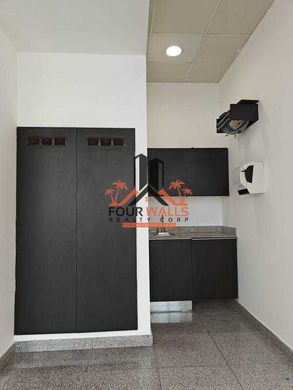 Small kitchenette with granite counters, cabinetry, air conditioning in PH Habitats Plaza Panama