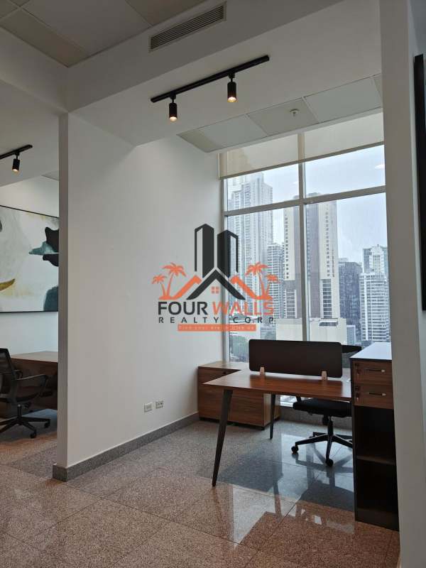 Open space with skyline views, track lighting and meeting table PH Habitats Plaza Panama