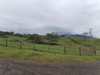 Countryside with hills, fence line, and mountain backdrop on large acreage for sale Chiriquí Panama