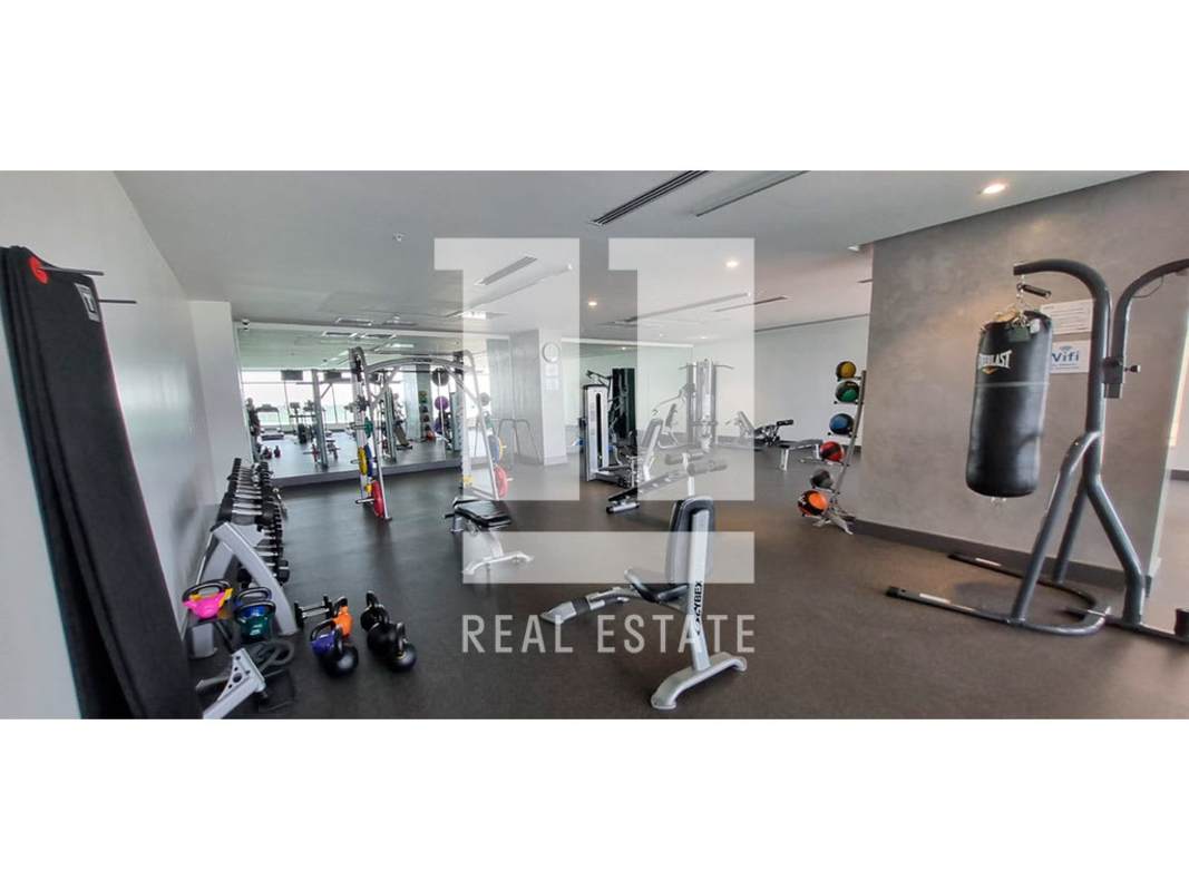 Indoor gym zone with weights, benches, equipment PH Green Garden Santa Maria Panama