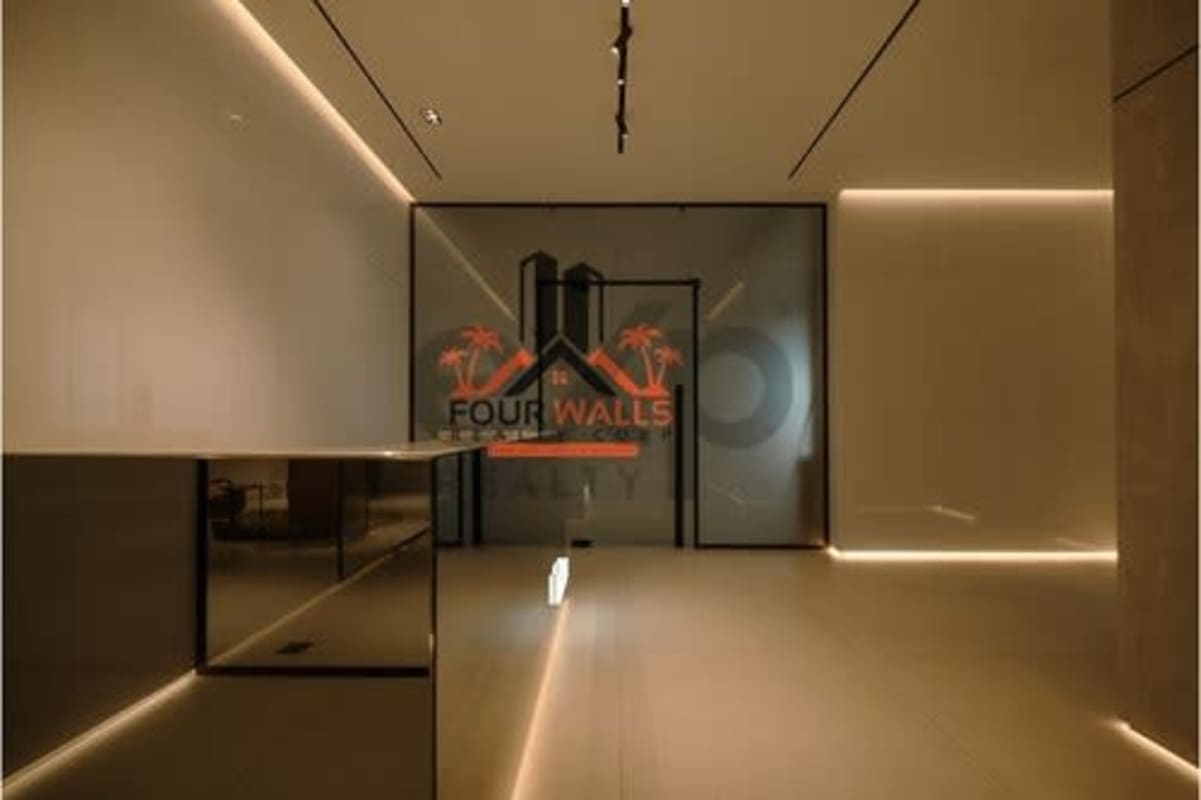 Minimalist lobby reception with accent lighting glass partition in luxury office tower Nuovo Plaza Armani Obarrio