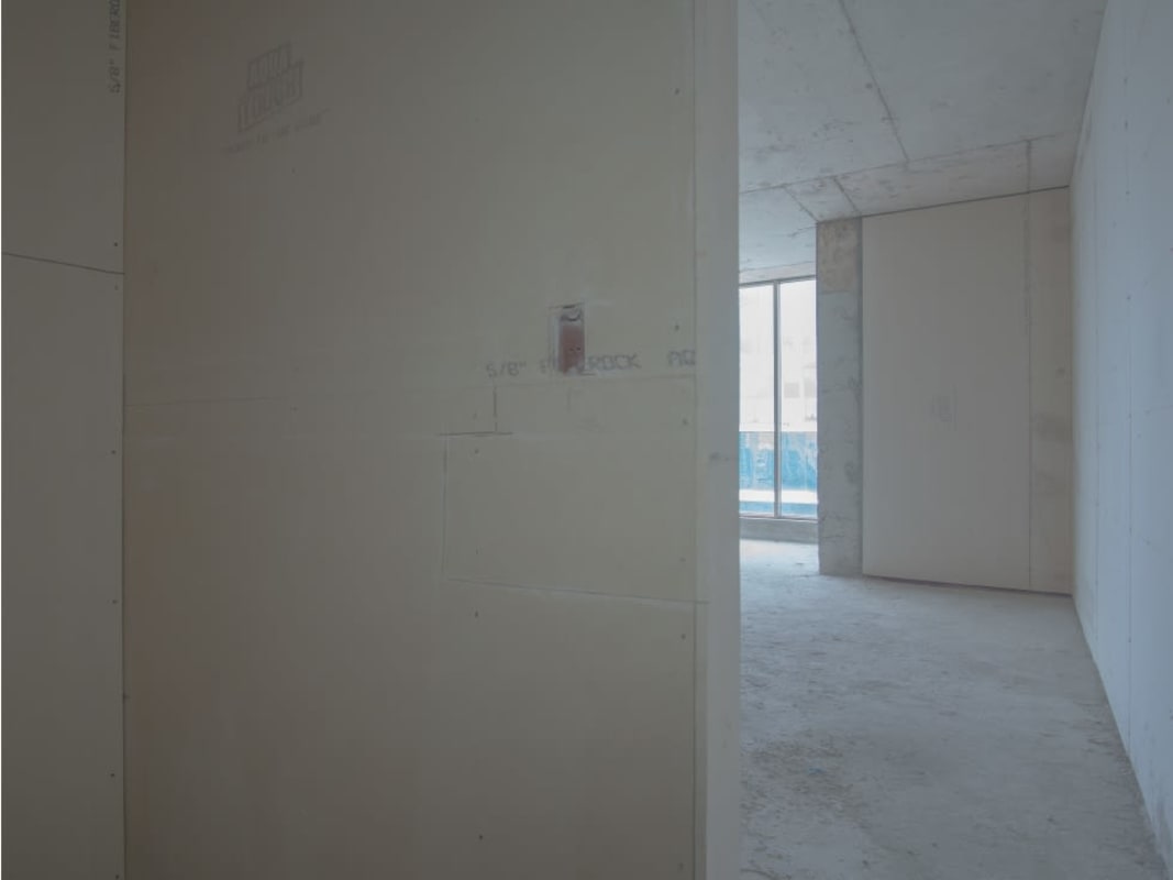 Unfinished interior workspace with windows in PH Twist Tower commercial building Panama City