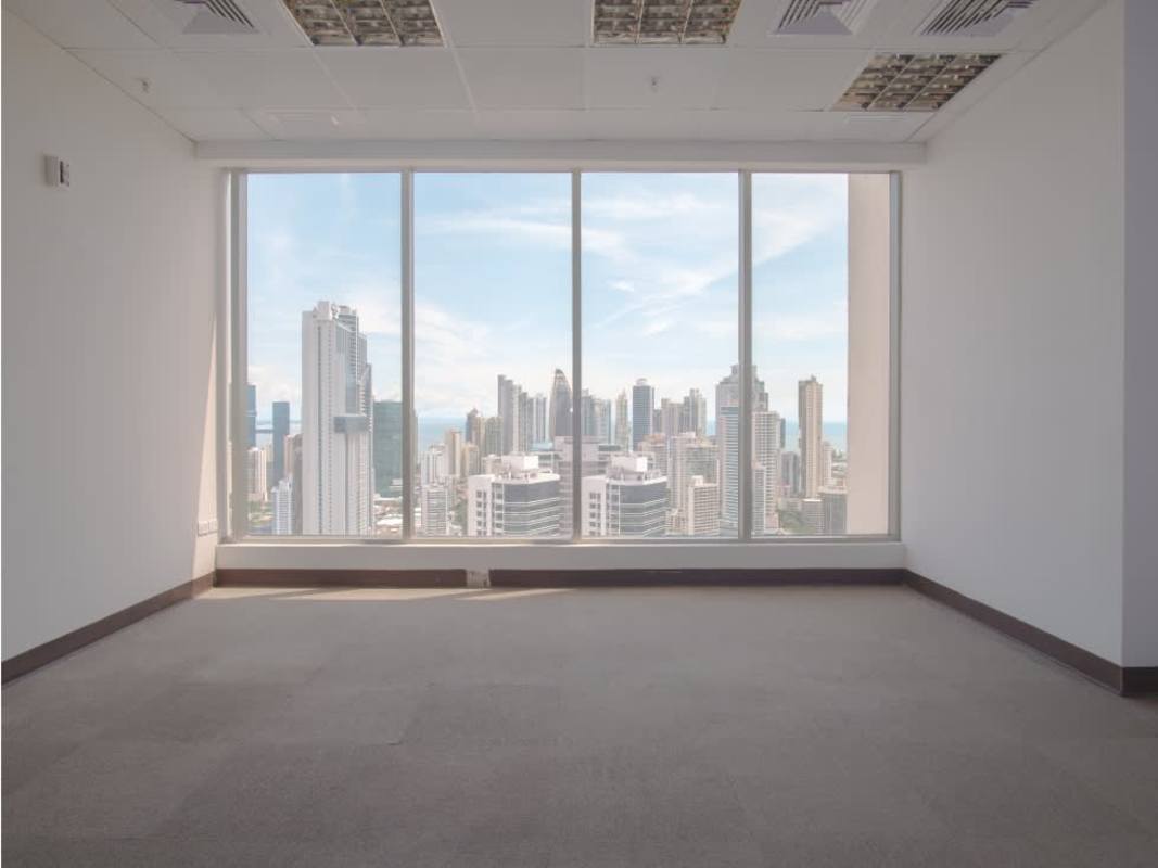 Empty open-plan office space PH BICSA Financial Center ceramic floors ceiling lights Panama City