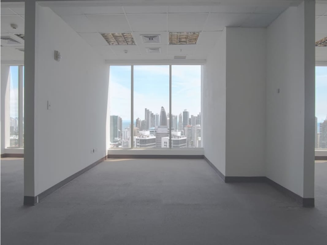 Spacious modern commercial office interior with panoramic windows overlooking Panama Bay at BICSA Financial Center