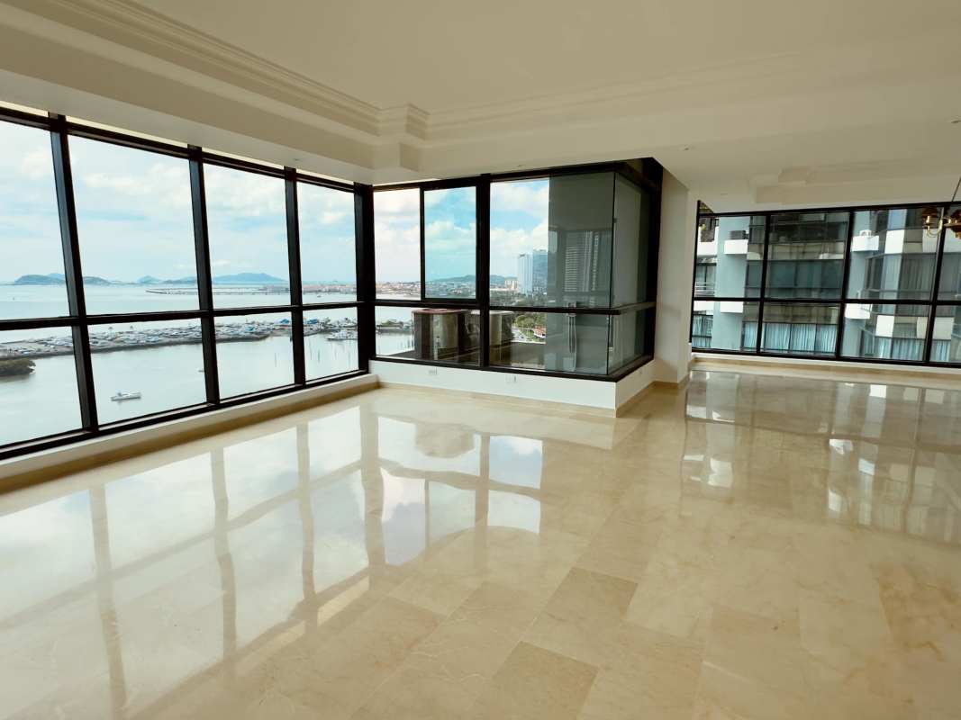 Bedroom with large window overlooking Panama City skyline PH Miramar Plaza Avenida Balboa