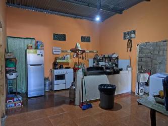 Basic rustic kitchen with appliances in residential home Nuevo Farallón