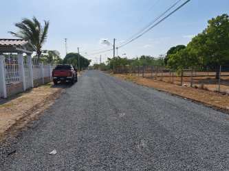 Gravel street with pickup and rural landscape near property Rio Hato Panama