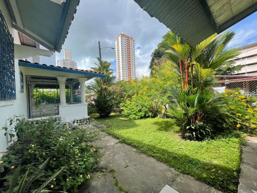 Empty kitchen with tiled walls, burgundy cabinets and window commercial lot San Francisco Panama
