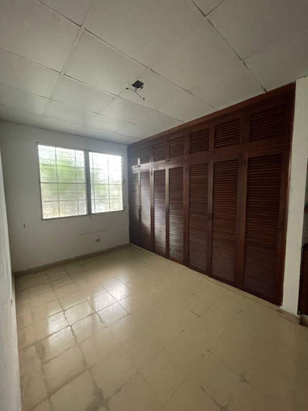 Unfurnished bedroom with large wooden closet tiled floor commercial house Panama